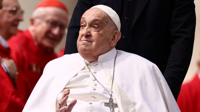 Pope Francis greets cardinals as he unexpectedly appears during the Palm Sunday Mass in Saint Peter's Square at the Vatican, April 13, 2025. Yara Nardi/Reuters