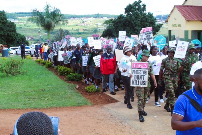 Community members and partners march through Nhlangano to demand justice and protection for children and vulnerable groups.