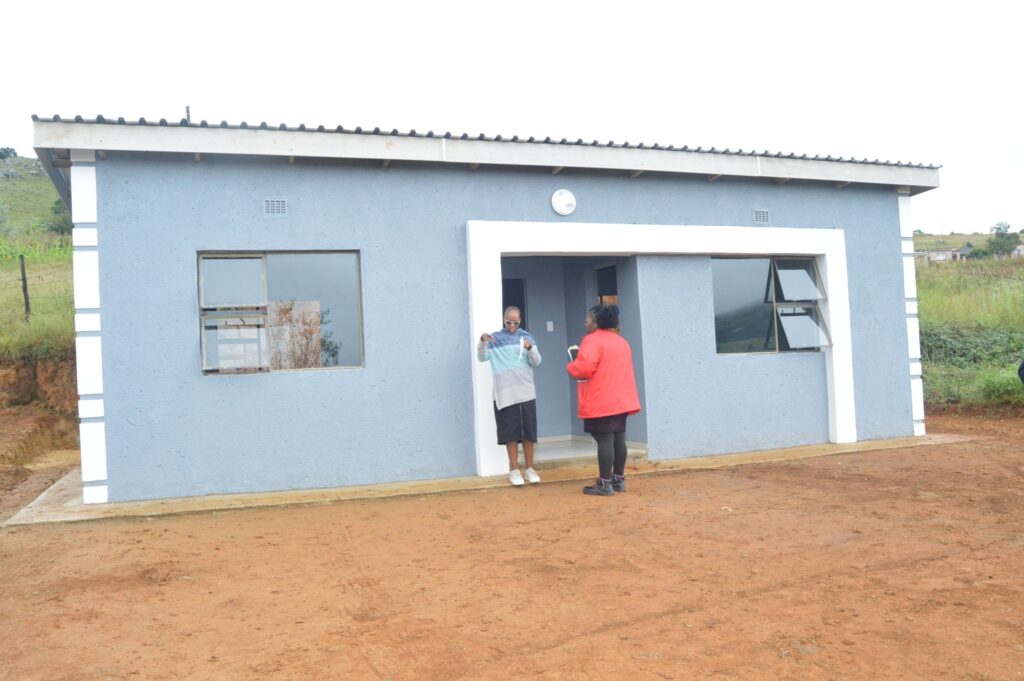Deputy Prime Minister Thulisile Dladla hands over keys to a new home during her visit to the Hhohho region.
