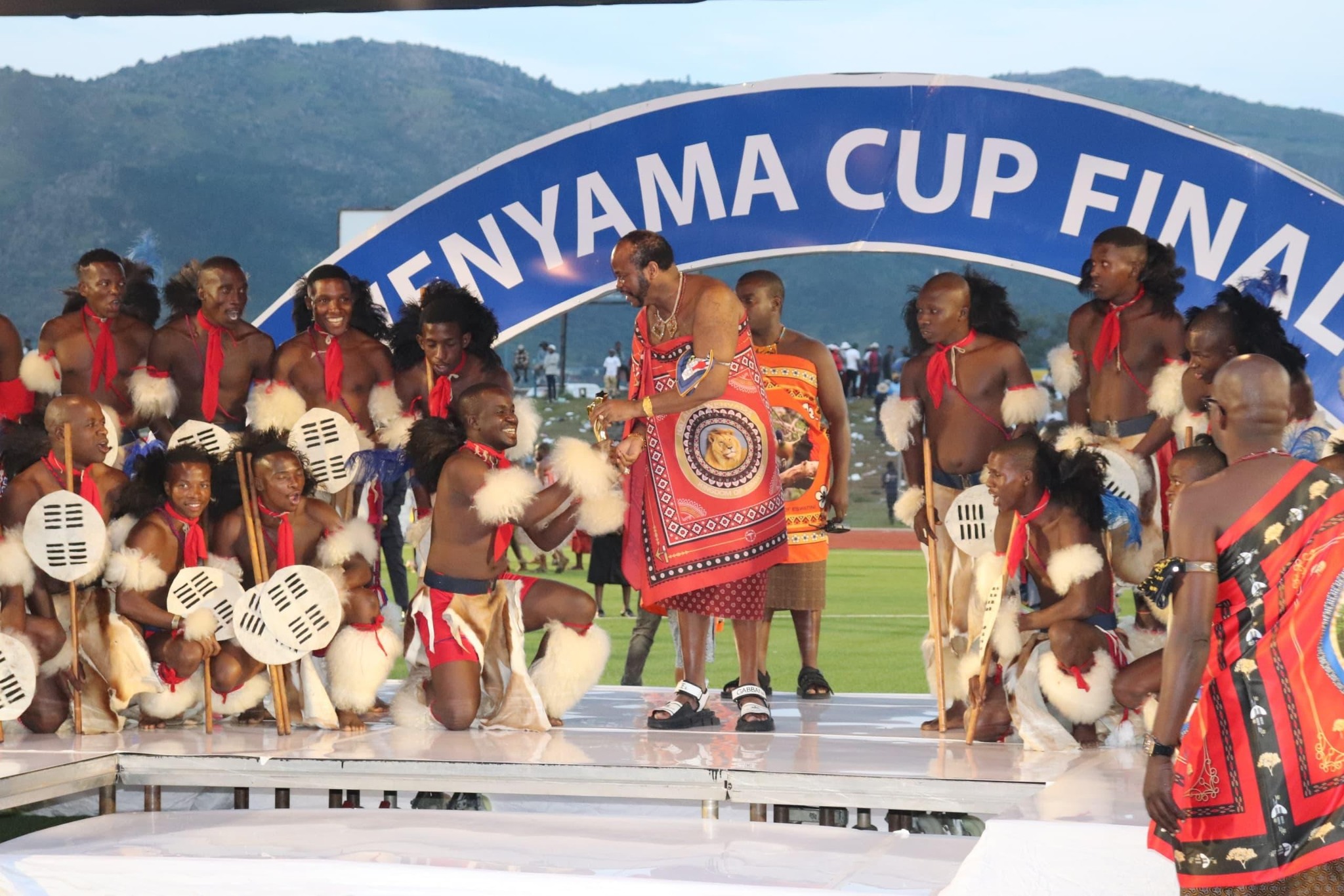His Majesty King Mswati III presents trophies to the 2025 Ingwenyama Cup champions during a vibrant ceremony at Somhlolo National Stadium.