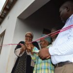 Deputy Prime Minister Thulisile Dladla hands over keys to a new home during her visit to the Hhohho region.