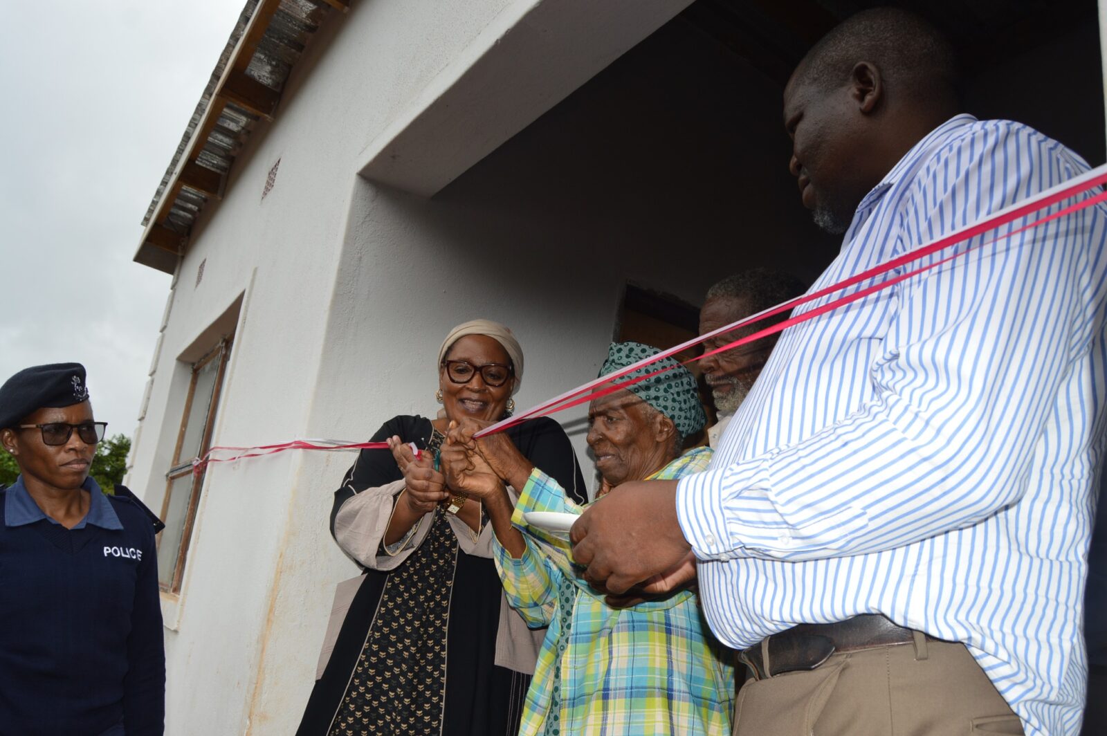 Deputy Prime Minister Thulisile Dladla hands over keys to a new home during her visit to the Hhohho region.