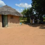 Deputy Prime Minister Thulisile Dladla engages with residents of Madlangemphisi Inkhundla during a visit to ten vulnerable households identified for housing support under the King’s directive to provide decent shelter.