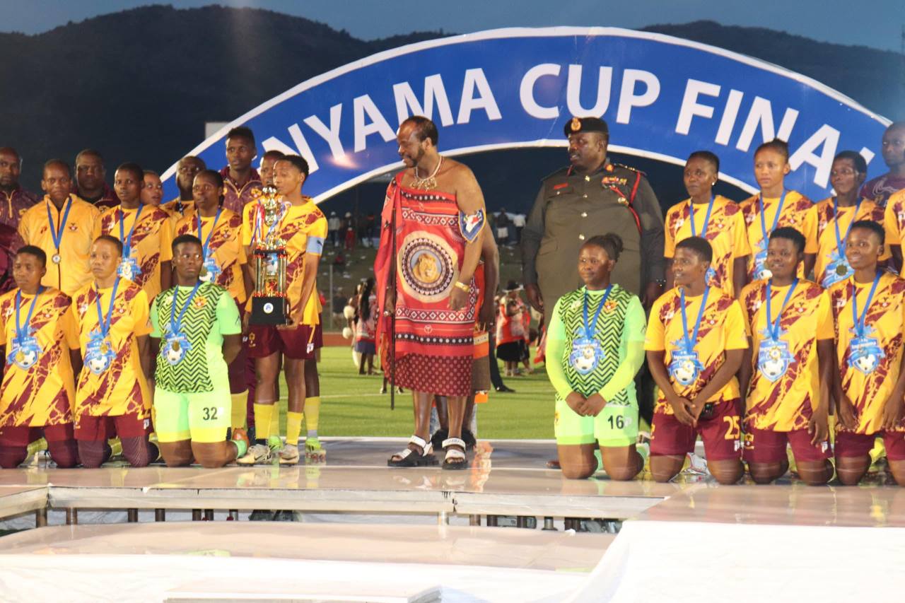 His Majesty King Mswati III presents trophies to the 2025 Ingwenyama Cup champions during a vibrant ceremony at Somhlolo National Stadium.