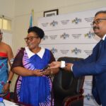 Deputy Prime Minister Thulisile Dladla receives vehicle keys from WFP's Ashraful Amin during the handover ceremony in Mbabane.