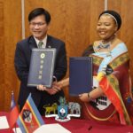 Eswatini and Taiwan officials shake hands after signing a pact to combat disinformation.