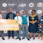 FNB Eswatini CEO Thokozani ‘TK’ Dlamini holds a symbolic cheque during the launch of the 2025 Entrepreneur of the Year Awards at Happy Valley Hotel.