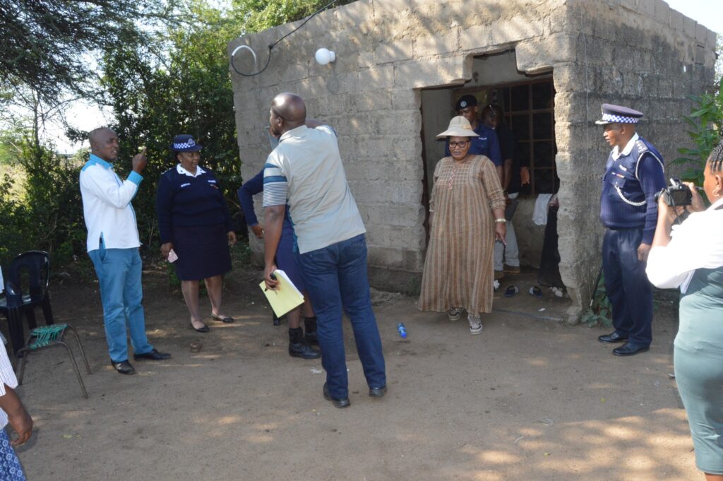 Deputy Prime Minister Thulisile Dladla inspects a dilapidated homestead in Mpolonjeni Inkhundla during a visit to assess housing needs among vulnerable families.