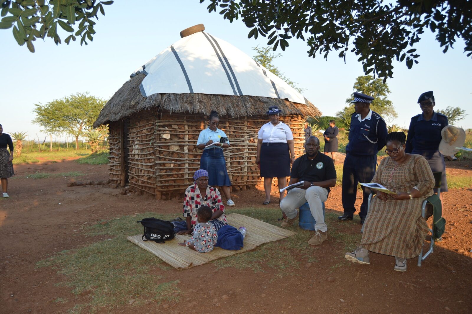 Deputy Prime Minister Thulisile Dladla inspects a dilapidated homestead in Mpolonjeni Inkhundla during a visit to assess housing needs among vulnerable families.