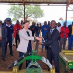 Minister of Agriculture Jabulani Mabuza and the European Union representative share a moment during the official handover of hay-making equipment worth E3.1 million at Mpisi Cattle Breeding Station.