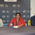 Deputy Prime Minister Thulisile Dladla shares a moment with Members of Parliament during the preview screening of the new family-reunion reality show, Asibambaneni Sibengumndeni, held at her office in Mbabane.