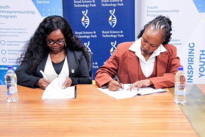 JA Eswatini Executive Director Phetsile Masilela signs the MoU with RSTP Acting CEO Nomvuyo Gulwako during a brief ceremony at the Royal Science and Technology Park. Photo: JA Eswatini