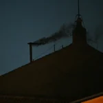 This photograph shows black smoke rising from the chimney of the Sistine Chapel signalling that cardinals failed to elect a new pope in the first ballot of their conclave in the Vatican on May 7, 2025. (Photo by Andreas SOLARO / AFP)