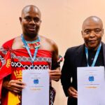 ETA CEO Vusie N. Dlamini and Acting KZN Tourism & Film CEO Dr. Sibusiso Gumbi shake hands after signing a tourism partnership agreement at Africa’s Travel Indaba in Durban.