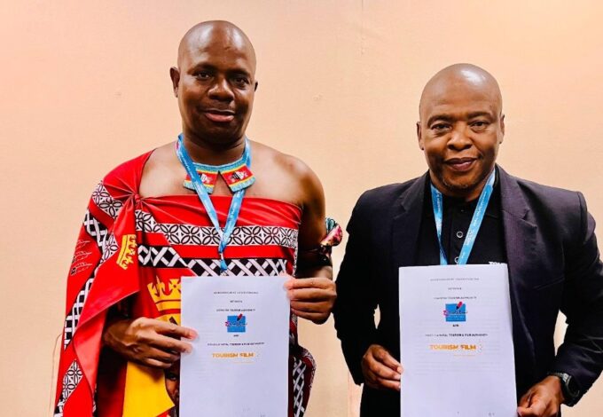 ETA CEO Vusie N. Dlamini and Acting KZN Tourism & Film CEO Dr. Sibusiso Gumbi shake hands after signing a tourism partnership agreement at Africa’s Travel Indaba in Durban.