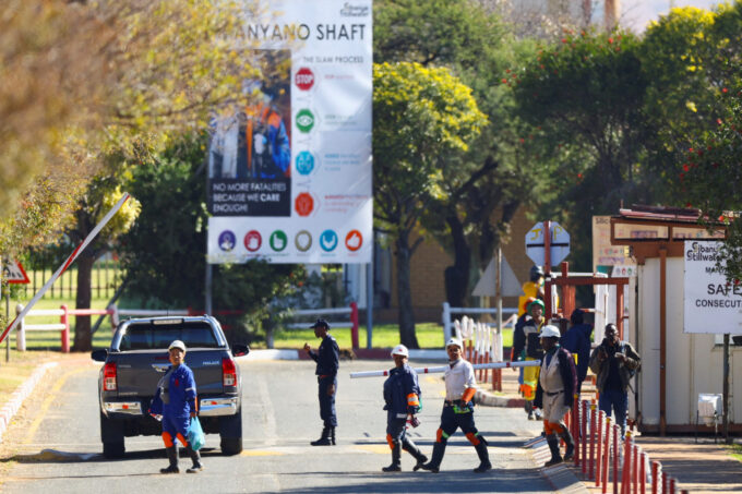 Mine workers walk after being rescued from underground at the Sibanye Stillwater mine in Westonaria, near Johannesburg, South Africa, May 23, 2025. They were trapped underground at one of the shafts at the Kloof gold mine. REUTERS/Siphiwe Sibeko