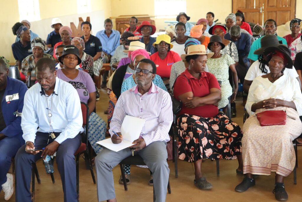 Residents of Lomahasha follow closely as government officials explain how to access digital services, photo by Ministry of Information, Communications and Technology.