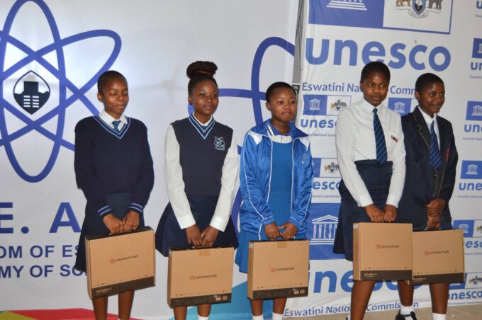 Learners from the Shiselweni Region hold laptops during a STEM activation programme supported by UNESCO and the Kingdom of Eswatini Academy of Sciences. Photo by UNESCO Eswatini.