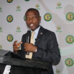 The Honourable Minister of Housing and Urban Development, Appolo Maphalala, addresses guests at the launch of the Nhlangano Town Council Marathon 2026 at Shingili Plaas Restaurant.
