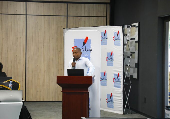 Gcina Dlamini presenting the 2026 Domestic Tourism Study findings during the stakeholder session at Happy Valley. Photo by ESEPARC.