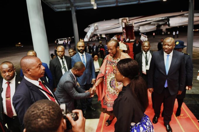 His Majesty King Mswati III greets a government official upon arrival at the 11th OACPS Summit in Malabo, Equatorial Guinea.