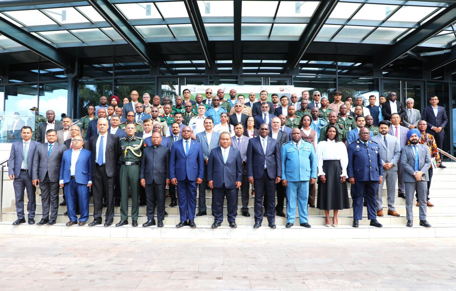 Casimiro Mueio and Indian High Commissioner Robert Shetkintong pose for a group photo with defence officials and industry representatives from Mozambique and India during the Defence Industry Seminar in Maputo.