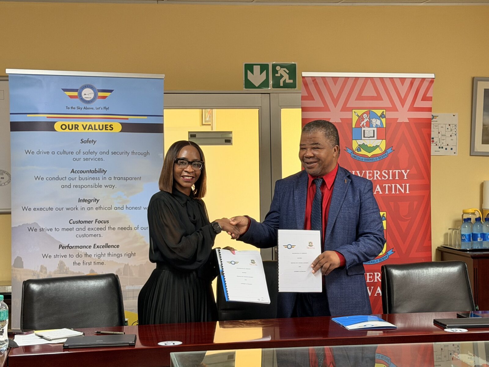 Ms. Andile Mtetwa-Amaeshi, ESWACAA Director General, and Prof. Justice Thwala, UNESWA Vice Chancellor, during the signing of the Memorandum of Agreement in Mbabane.
