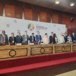 Mr Phesheya Dube, Under Secretary in the Ministry of Commerce, Industry and Trade, joins fellow delegates on stage during the 14th WTO Ministerial Conference in Yaoundé, Cameroon.