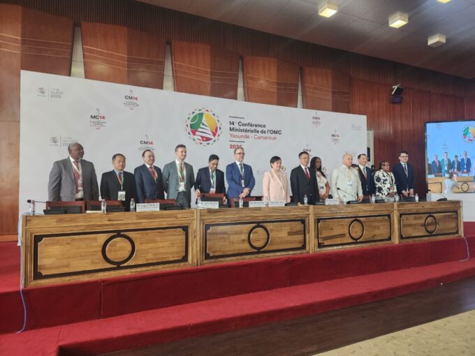 Mr Phesheya Dube, Under Secretary in the Ministry of Commerce, Industry and Trade, joins fellow delegates on stage during the 14th WTO Ministerial Conference in Yaoundé, Cameroon.