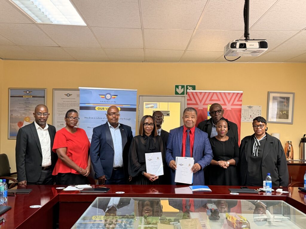 ESWACAA and UNESWA leaders pose with stakeholders following the signing of the Management Development Programme agreement in Mbabane.
