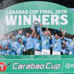 Manchester City players lift the Carabao Cup trophy in celebration after their triumph. Photo by X/@ManCity.