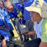 Zandisile Howe from the Eswatini Environment Authority guides students at Shewula High School during the Hlanyela Likusasa tree planting campaign.