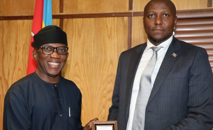 Prime Minister Russell Mmiso Dlamini receives the Effective Governance Peace Division award from African Union Commissioner Ambassador Bankole Adeoye at the Private and Cabinet Office in Mbabane.