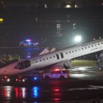 Emergency crews work around an Air Canada Express jet that had collided with a ground vehicle at New York's La Guardia Airport in Queens, New York, U.S. March 23, 2026. REUTERS/Bing Guan