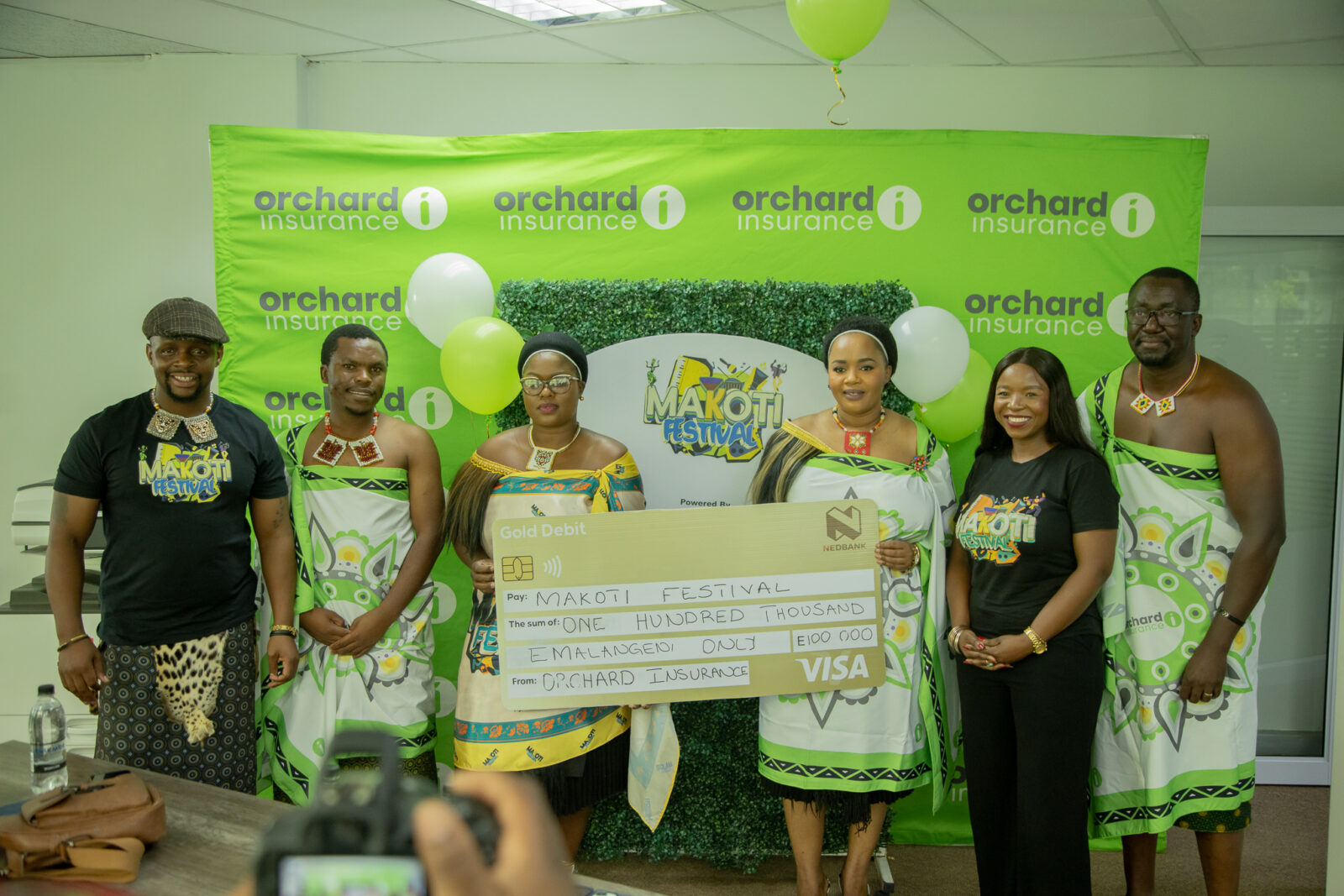 Partners display the E100 000 printed cheque for the Makoti Festival raffle draw during the announcement. Photo credit: Supplied.