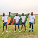 Zambia Revenue Authority players celebrate with their national flag after winning the SAIRAG 2026 football title in Swakopmund. Photo by Zambia Revenue Authority