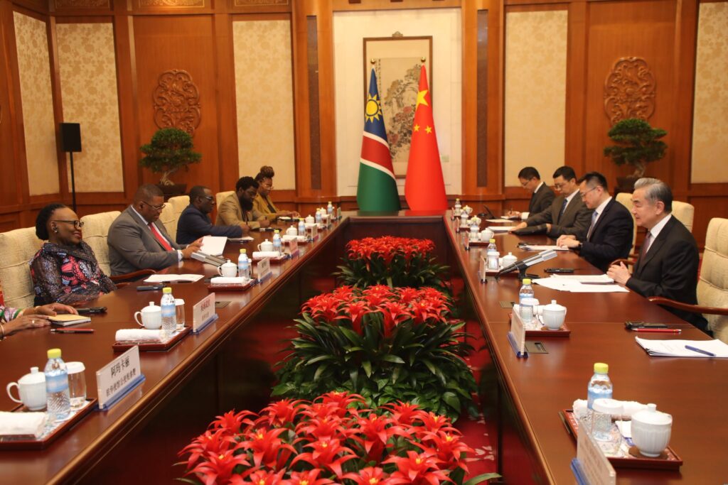 Namibia's Minister of International Relations and Trade Selma Ashipala-Musavyi and Chinese Foreign Minister Wang Yi lead their respective delegations during talks in Beijing on April 17, 2026,