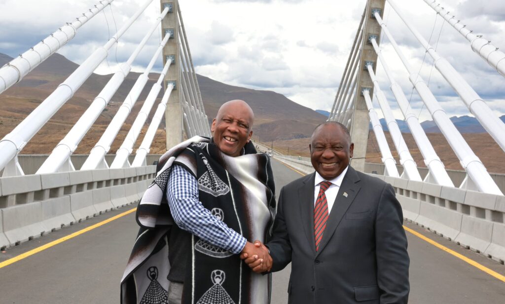 South African President Cyril Ramaphosa and Lesotho King Letsie III share a handshake during the official launch of the Senqu Bridge in Mokhotlong, Kingdom of Lesotho, on April 22, 2026.