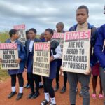 Students carry mini placards during a campaign against teenage pregnancy held in the Ngudzeni constituency in the Shiselweni Region on Tuesday. Photo: Royal Eswatini Police Service