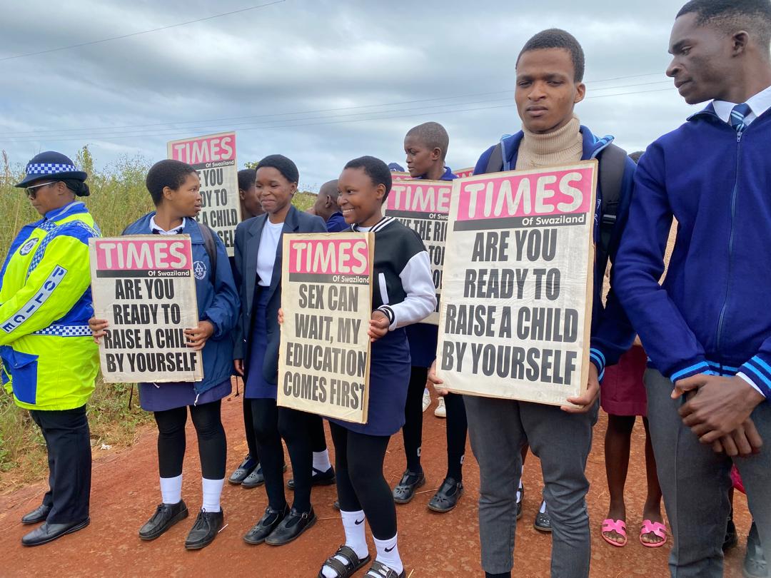 Students carry mini placards during a campaign against teenage pregnancy held in the Ngudzeni constituency in the Shiselweni Region on Tuesday. Photo: Royal Eswatini Police Service