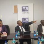 Minister of Commerce, Industry and Trade Manqoba Khumalo listens to the Eswatini Standards Authority's 2024 to 2025 progress report at the ESWASA offices