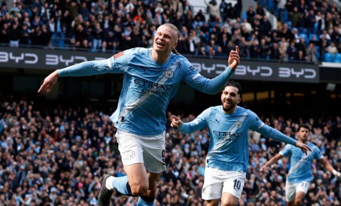 Erling Haaland’s penalty celebration was quickly followed by his second goal before half-time. Photograph: Jason Cairnduff/Action Images/Reuters