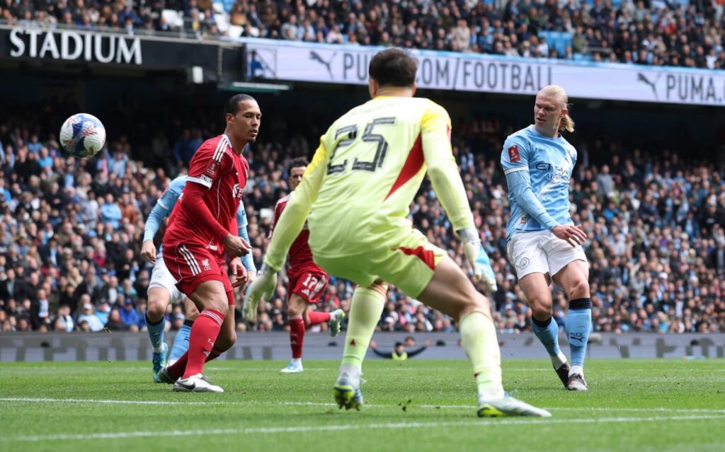 Erling Haaland scores Manchester City’s fourth goal to complete his hat-trick. Photograph: Phil Noble/Reuters