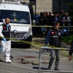 Police officials gather outside The Israeli Consulate in Istanbul following a shootout between gunmen and police [AFP]
