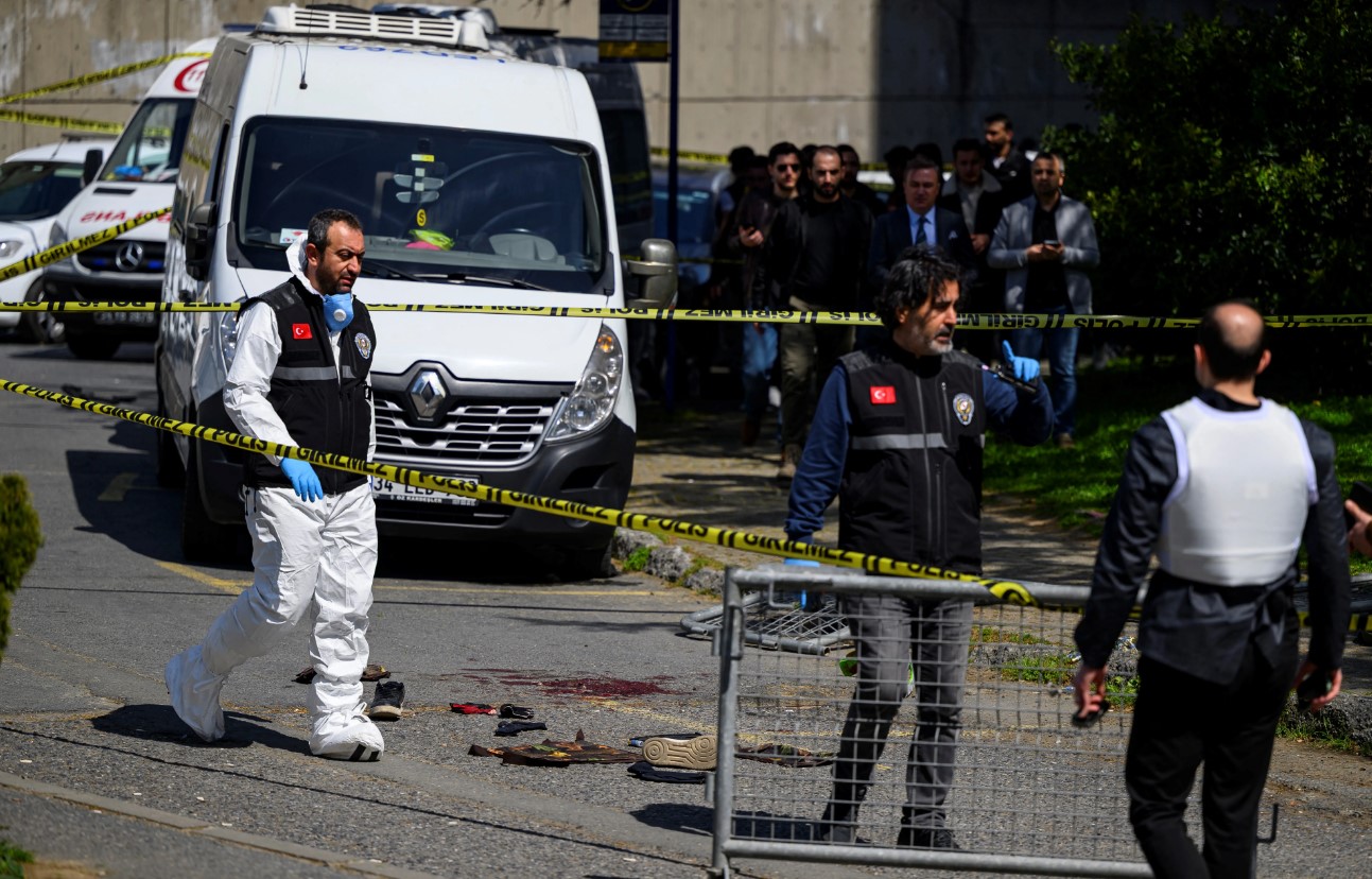 Police officials gather outside The Israeli Consulate in Istanbul following a shootout between gunmen and police [AFP]