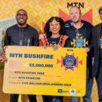 MTN Eswatini officials, MTN Bushfire organisers and partners pose for a group photo with the E5 million cheque during the official launch of MTN Bushfire 2026 at House on Fire in Malkerns.