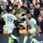 Marc Guehi celebrates with his Manchester City team mates after scoring the second goal in their 3-0 Premier League win over Chelsea at Stamford Bridge on Sunday.
