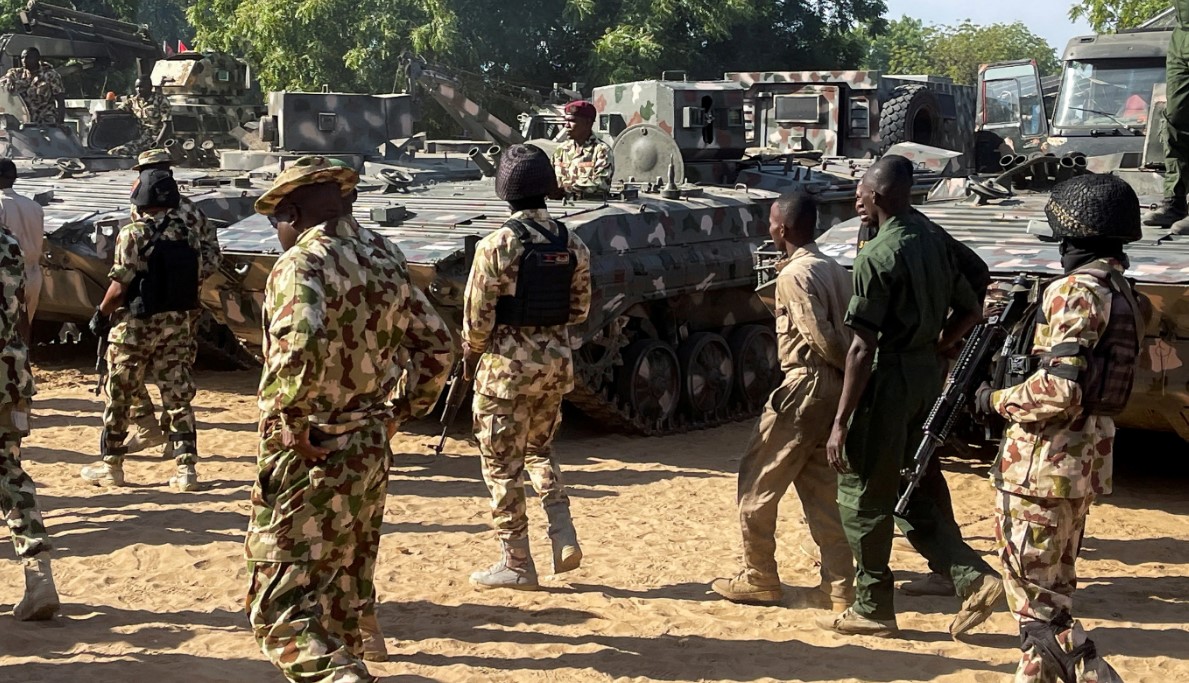 Nigerian soldiers walk past military tanks in Maiduguri, Borno State, Nigeria on November 7, 2025 [File: Ahmed Kingimi/Reuters]
