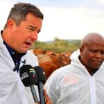 South African Minister of Agriculture John Steenhuisen addresses farmers, veterinary officials and community leaders during a joint foot-and-mouth disease vaccination and awareness drive along the Trans Kalahari Corridor at Swartkopfontein