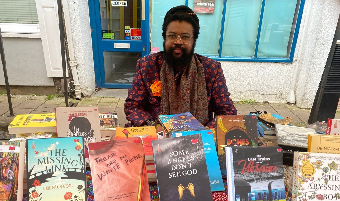 Nigerian author and filmmaker Onyeka Nwelue pictured with some of his more than 40 published books